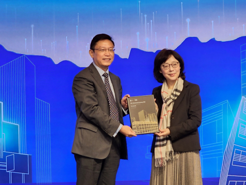 Professor Wei Pan receives the Outstanding People (MiC Advocator) Award from Ms Bernadette Linn, Secretary for Development, HKSAR